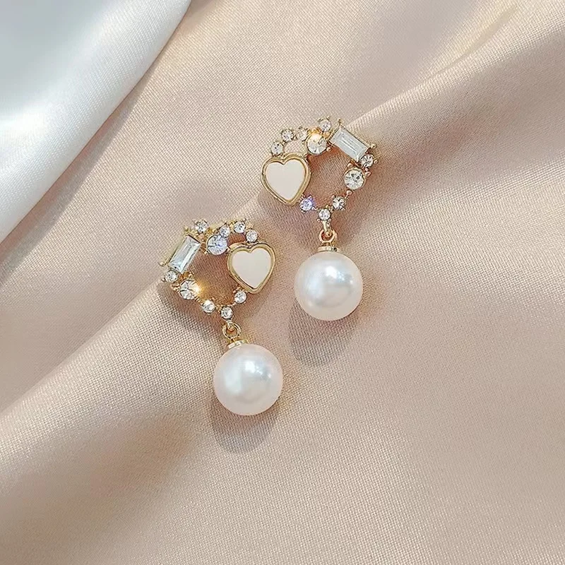 925 Silver Needle Super Flash Double Love Diamond Pearl Earrings for Women Korean Fashion Style Niche Temperament Earrings
925 Silver Needle Super Flash Double Love Diamond Pearl Earrings for Women Korean Fashion Style Niche Temperament Earrings