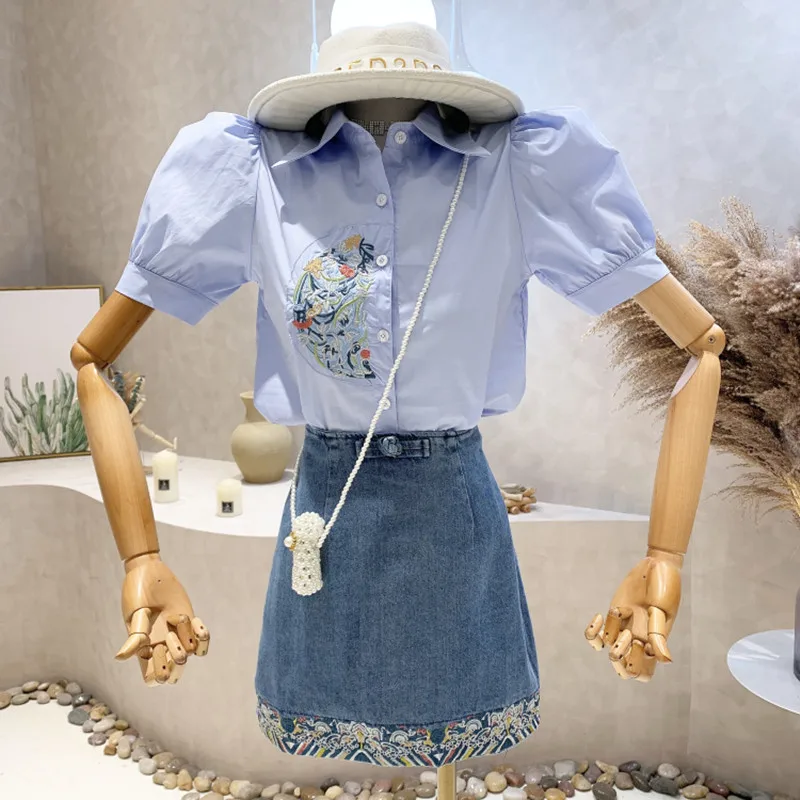 New Women's Clothing 2022 Summer Bubble short sleeve Embroidered Shirt Top + high waist denim skirt two-piece set
New Women's Clothing 2022 Summer Bubble short sleeve Embroidered Shirt Top + high waist denim skirt two-piece set