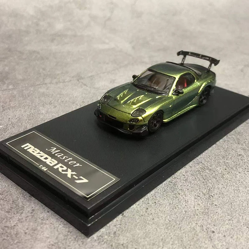 Мастер 1:64 модель автомобиля Mazda RX-7 FD3S лимитированный литой автомобиль 699-волшебный зеленый
Мастер 1:64 модель автомобиля Mazda RX-7 FD3S лимитированный литой автомобиль 699-волшебный зеленый