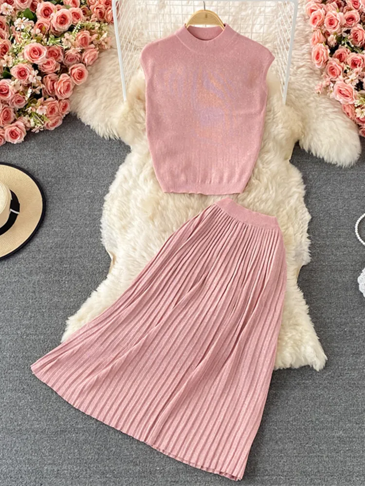 Autumn New Pleated Skirt Knitwear Suits Simple Fashion Solid Shinny Sleeveless Tops and Long Skirt Knit 2 Piece Sets Women
Autumn New Pleated Skirt Knitwear Suits Simple Fashion Solid Shinny Sleeveless Tops and Long Skirt Knit 2 Piece Sets Women