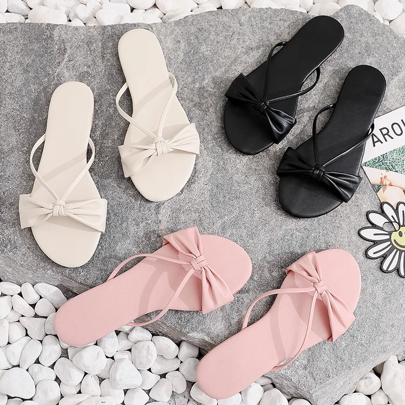 Women Slippers Sandals Fashion Thin Strap Bow Solid Color Simple Flip Flop Outside Wear Non-Slip Seaside Slippers 2022 Summer
Women Slippers Sandals Fashion Thin Strap Bow Solid Color Simple Flip Flop Outside Wear Non-Slip Seaside Slippers 2022 Summer