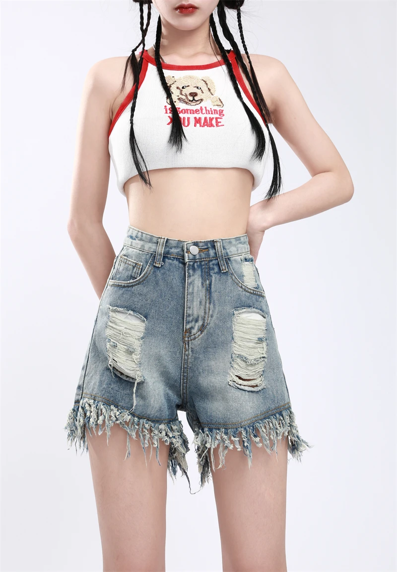 Винтажная женская джинсовая короткая юбка трапециевидной формы с бахромой и дырками, летняя новая повседневная пикантная мини-юбка в уличном стиле для женщин 
Винтажная женская джинсовая короткая юбка трапециевидной формы с бахромой и дырками, летняя новая повседневная пикантная мини-юбка в уличном стиле для женщин