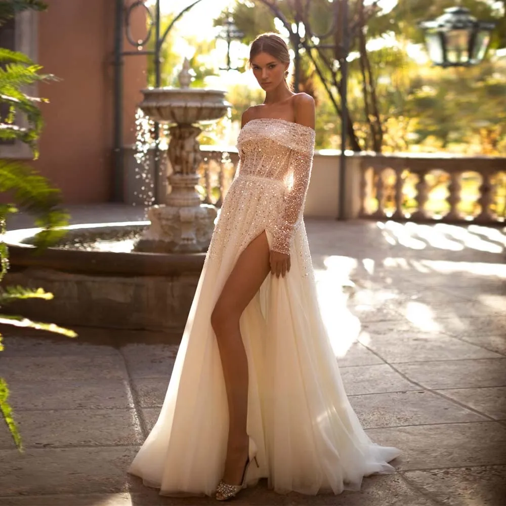 Exquisite Wedding Dresses Sparkle Sequin Boat Collar Bride Dress 2022 Off Shoulder Detachable Sleeve High Slit Tulle Bridal Gown
Exquisite Wedding Dresses Sparkle Sequin Boat Collar Bride Dress 2022 Off Shoulder Detachable Sleeve High Slit Tulle Bridal Gown