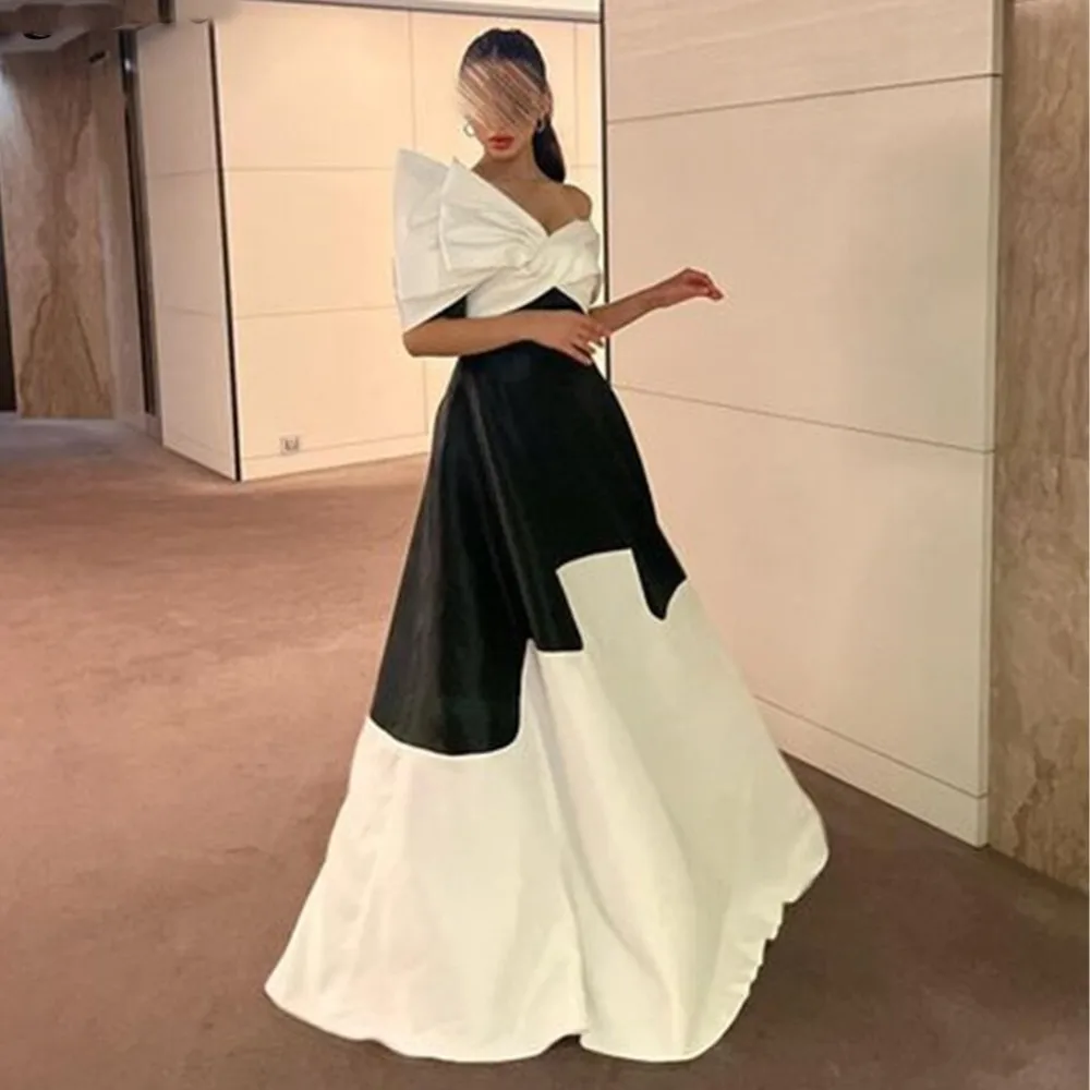 Sayulita Выпускные платья для женщин 2023 черные и цвета слоновой кости контрастных цветов с бантом с открытыми плечами вечерние платья а-силуэт официальное платье 
Sayulita Выпускные платья для женщин 2023 черные и цвета слоновой кости контрастных цветов с бантом с открытыми плечами вечерние платья а-силуэт официальное платье