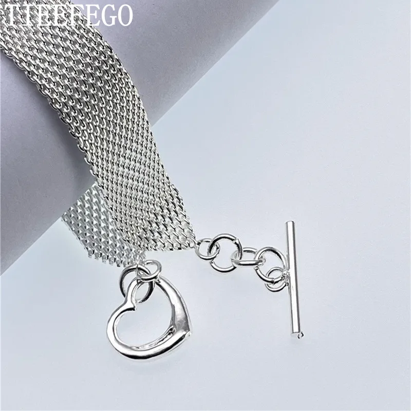 TIEEFEGO New 925 Silver T-Heart Mesh Bracelet Ladies Fashion Charm Popular Wedding Party Accessories Valentine's Day Gifts
TIEEFEGO New 925 Silver T-Heart Mesh Bracelet Ladies Fashion Charm Popular Wedding Party Accessories Valentine's Day Gifts