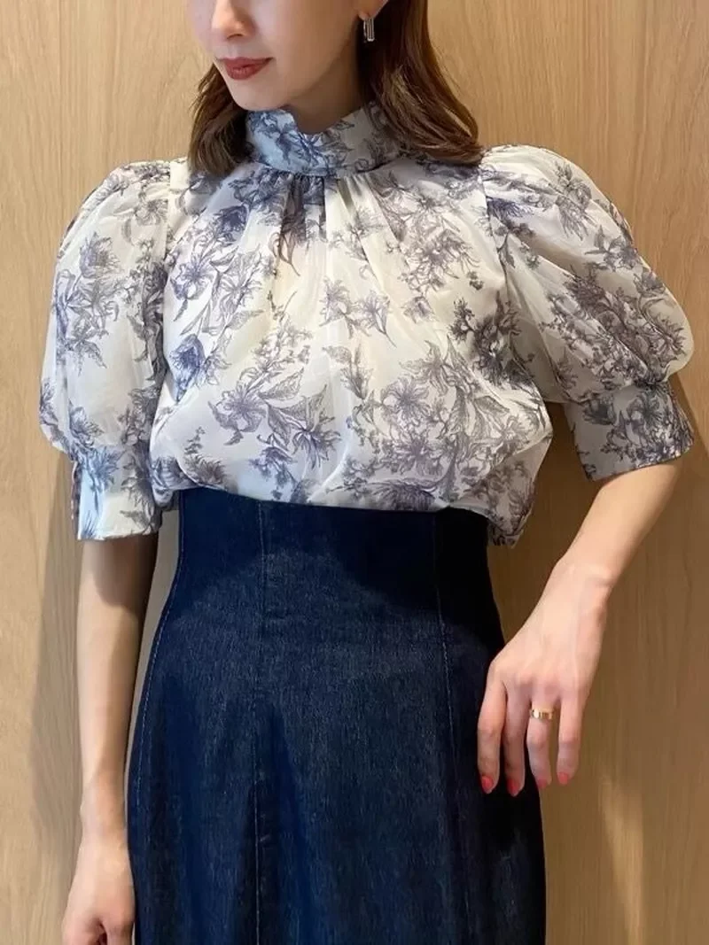 Kuzuwata Summer New Women Blouses Stand Collar Lantern Sleeve Lace Up Print Shirt Tulle Fairy Top Fashion Japanese Mujer Blusa
Kuzuwata Summer New Women Blouses Stand Collar Lantern Sleeve Lace Up Print Shirt Tulle Fairy Top Fashion Japanese Mujer Blusa