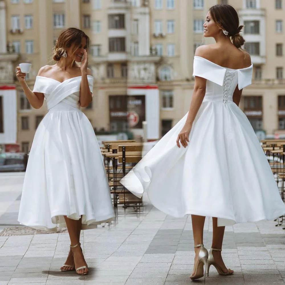 Новые свадебные платья-трапеции цвета слоновой кости с открытыми плечами, атласные платья до середины икры с открытой спиной
Новые свадебные платья-трапеции цвета слоновой кости с открытыми плечами, атласные платья до середины икры с открытой спиной