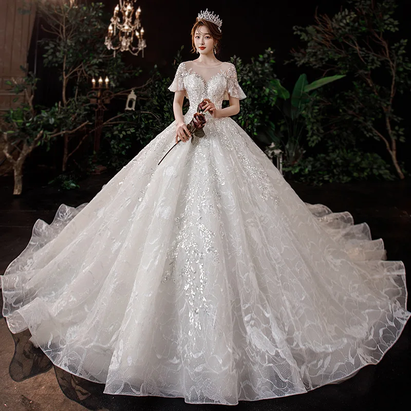 Exquisite O-Neck Short Sleeve Dubai Ball Gown Wedding Dress Sparkly Crystal Appliques Backless Saudi Arabic Bridal Gown
Exquisite O-Neck Short Sleeve Dubai Ball Gown Wedding Dress Sparkly Crystal Appliques Backless Saudi Arabic Bridal Gown