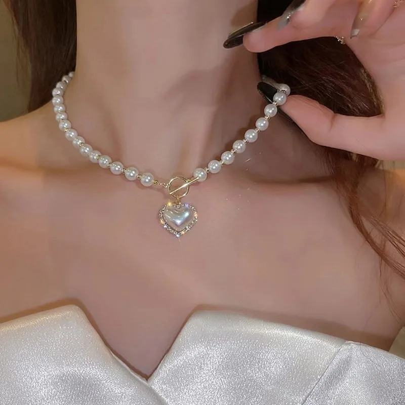 New Style Super Fairy Temperament Imitation Pearl Heart Necklace Cold Style Sweet Simple OT Buckle Clavicle Chain Women
New Style Super Fairy Temperament Imitation Pearl Heart Necklace Cold Style Sweet Simple OT Buckle Clavicle Chain Women