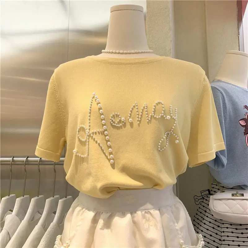 2023 Spring Summer New Elegant Round Neck Pearl Letter Loose Women's Short Sleeve T-shirt Casual Fashion Vintage Tops
2023 Spring Summer New Elegant Round Neck Pearl Letter Loose Women's Short Sleeve T-shirt Casual Fashion Vintage Tops
