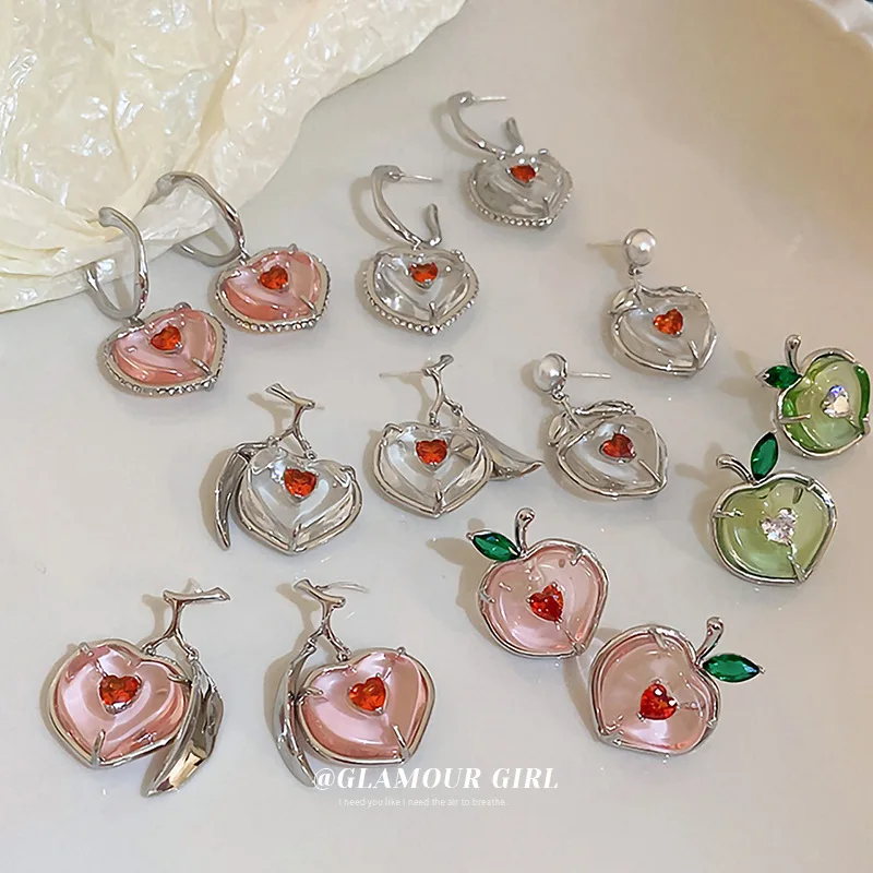 Zircon Crystal Heart Peach Earrings Japanese and Korean Girl Sweet Temperament Summer Earrings Wholesale
Zircon Crystal Heart Peach Earrings Japanese and Korean Girl Sweet Temperament Summer Earrings Wholesale