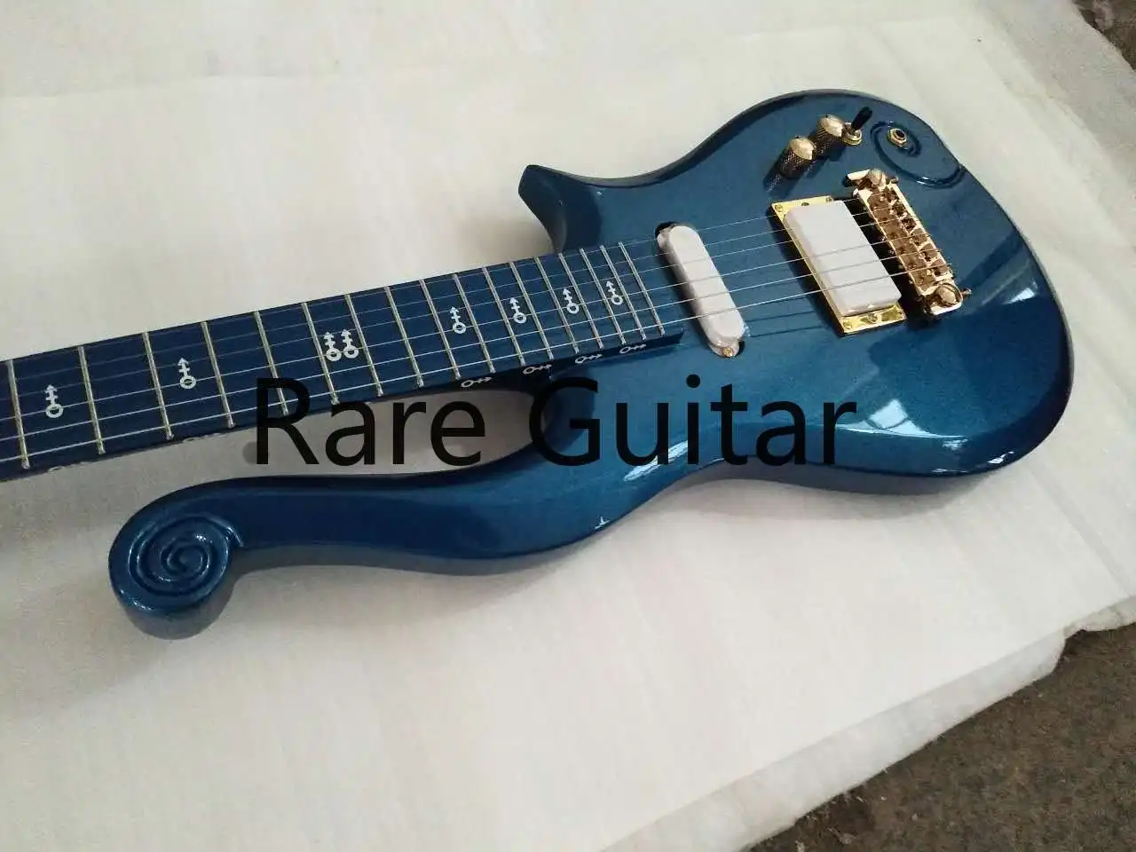 

Diamond Series Prince Cloud Metallic Blue Electric Guitar Alder Body, Maple Neck, Symbol Inlay, Gold Truss Rod Cover,