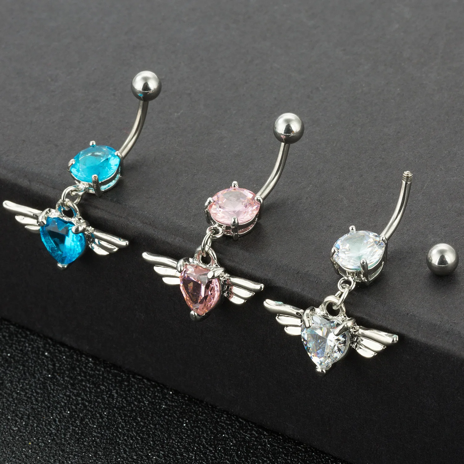 2pcs Heart Wing Belly Navel Ring Dangle 316L Surgical Steel Angel Love Zircon Belly Button Rings Pircing Women Body Jewelry
2pcs Heart Wing Belly Navel Ring Dangle 316L Surgical Steel Angel Love Zircon Belly Button Rings Pircing Women Body Jewelry
