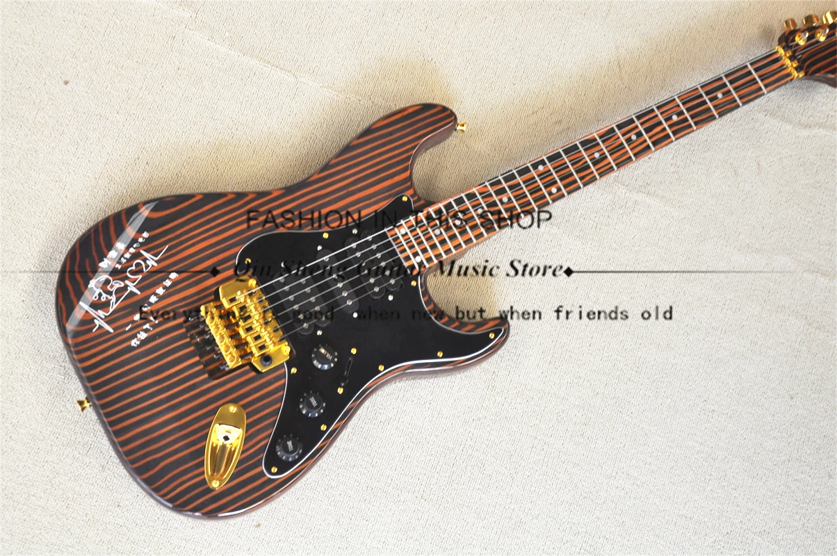 Классическая деревянная электрогитара Zebra Strat, гитара, корпус зебры и шея, Тройной мост, золотой тюнер, черная защита, 24 лада
Классическая деревянная электрогитара Zebra Strat, гитара, корпус зебры и шея, Тройной мост, золотой тюнер, черная защита, 24 лада