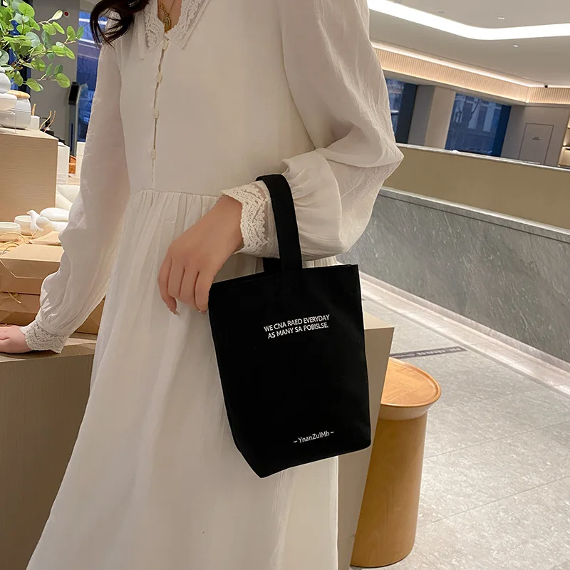 2023 new mini portable minimalist style canvas bag lunch bag candy color kettle plain canvas wrist strap bag
2023 new mini portable minimalist style canvas bag lunch bag candy color kettle plain canvas wrist strap bag