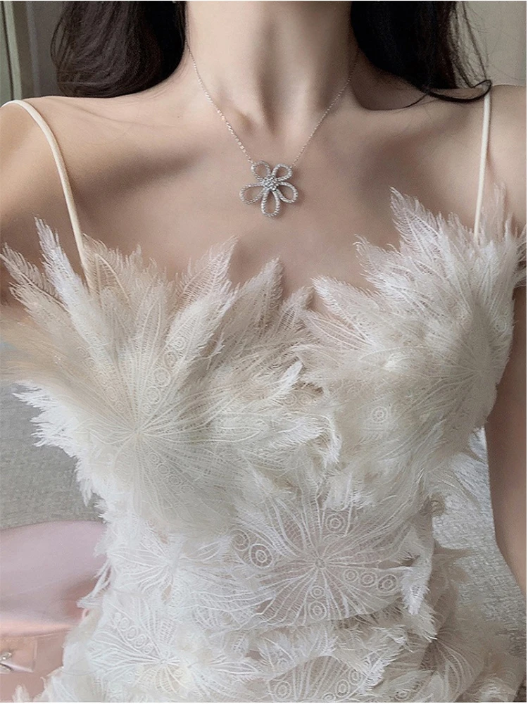 Designer High Quality French White Feather Lace Floral Fairycore Dress 2023 Summer Hollow Out Sexy Slim Waist Suspender Dresses
Designer High Quality French White Feather Lace Floral Fairycore Dress 2023 Summer Hollow Out Sexy Slim Waist Suspender Dresses