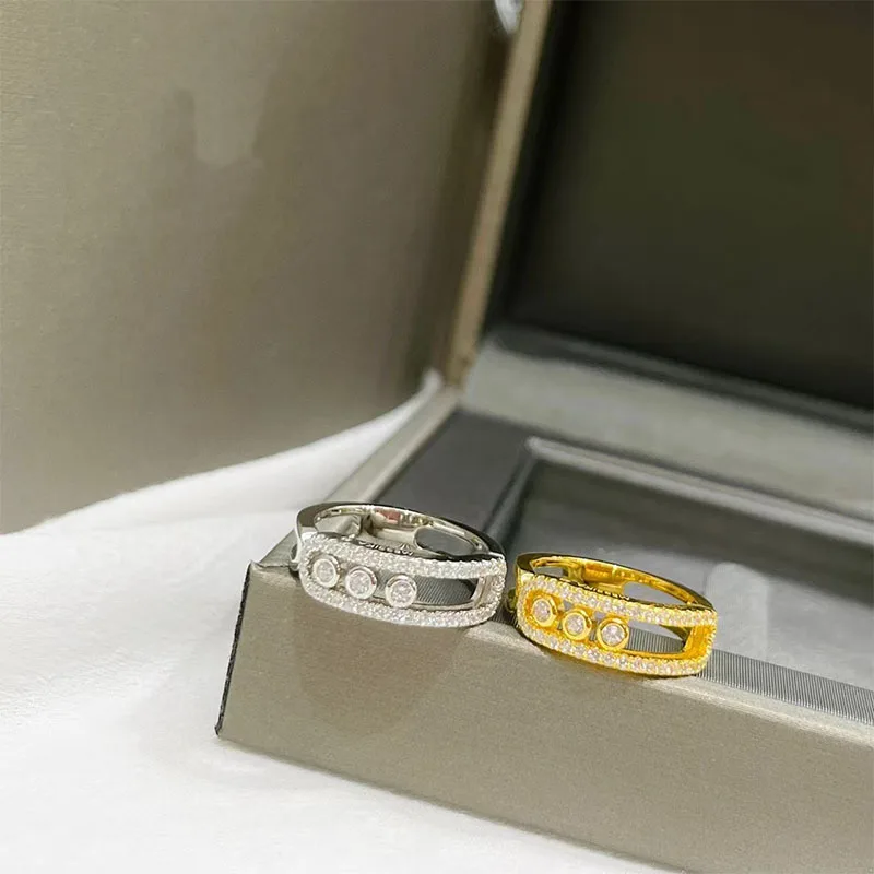 Fashion classic 925 Sterling Silver Plated 14K Gold three diamond sliding diamond ring trend personalized simple ring
Fashion classic 925 Sterling Silver Plated 14K Gold three diamond sliding diamond ring trend personalized simple ring
