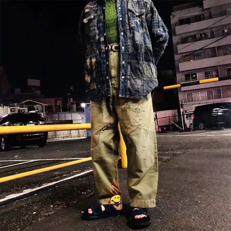 KAPITAL Smiling Face Embroidery Damage Patch Dilapidated Washing Tapered Pants Overalls For Men Wome
KAPITAL Smiling Face Embroidery Damage Patch Dilapidated Washing Tapered Pants Overalls For Men Wome