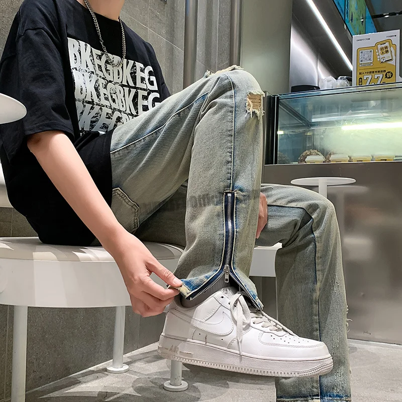 Side Slit Zipper Pierced Jeans Men's Straight Tube Micro Flared Pants Autumn American High Street Vibe Fashion Zipper Hem Jeans
Side Slit Zipper Pierced Jeans Men's Straight Tube Micro Flared Pants Autumn American High Street Vibe Fashion Zipper Hem Jeans