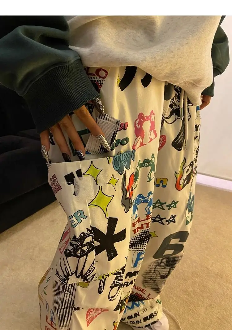 Спортивные брюки Y2K с граффити, женская уличная одежда, корейские хип-хоп брюки-карго в стиле Харадзюку, парашютные тренировочные штаны, женские брюки с широкими штанинами для бега, 2023
Спортивные брюки Y2K с граффити, женская уличная одежда, корейские хип-хоп брюки-карго в стиле Харадзюку, парашютные тренировочные штаны, женские брюки с широкими штанинами для бега, 2023