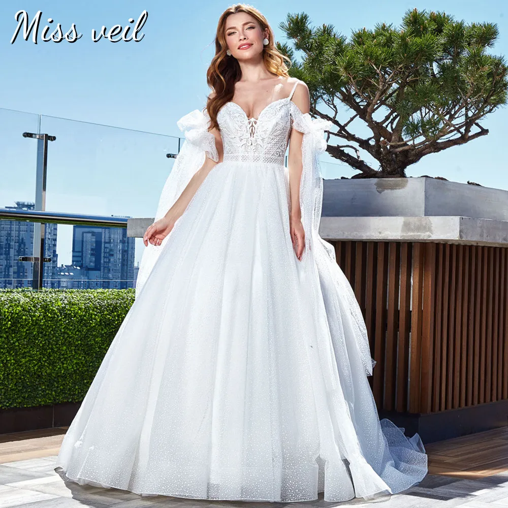 Miss veil Sparkle Tulle Bridal Gown Spaghetti Straps Boho Lace Appliques Wedding Dress Backless Zipper Train Vestidos De Noiva
Miss veil Sparkle Tulle Bridal Gown Spaghetti Straps Boho Lace Appliques Wedding Dress Backless Zipper Train Vestidos De Noiva