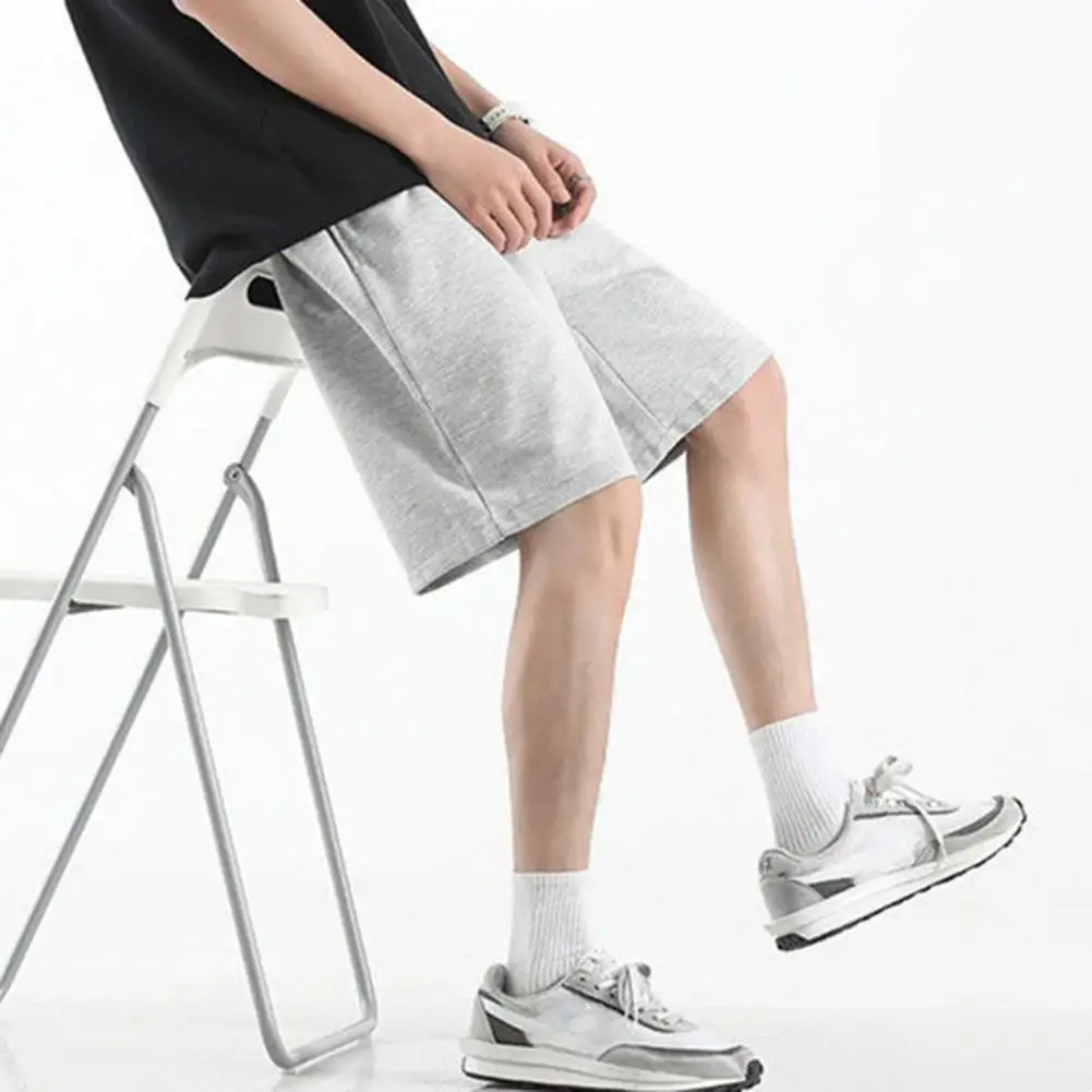 Mid-Rise Elastic Waistband Men Shorts Drawstring Pockets Wide Leg Knee Length Solid Color Loose Fitness Running Shorts Sportwear
Mid-Rise Elastic Waistband Men Shorts Drawstring Pockets Wide Leg Knee Length Solid Color Loose Fitness Running Shorts Sportwear