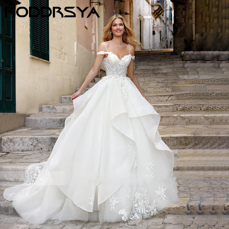 RODDRSYA Sweetheart Spaghetti Strap Wedding Dress Romantic Organza Appliques Bride Party Sexy Lace Up Sleeveless Suknia ślubna
RODDRSYA Sweetheart Spaghetti Strap Wedding Dress Romantic Organza Appliques Bride Party Sexy Lace Up Sleeveless Suknia ślubna
