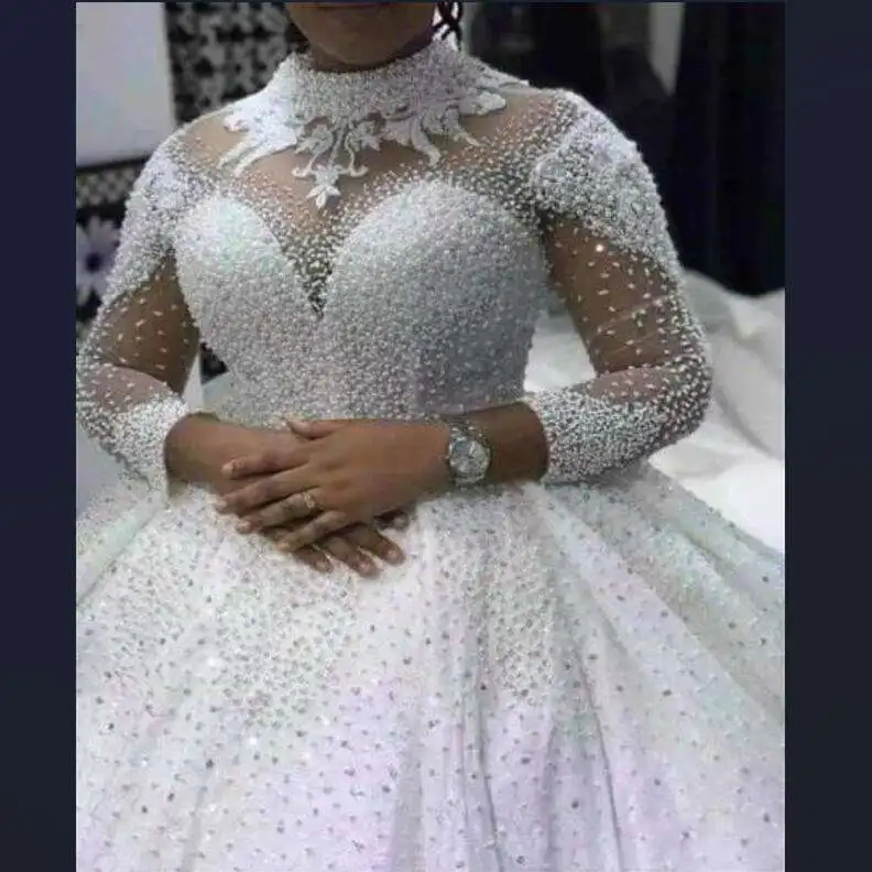 Spring Luxury Heavy Pearls Beaded Wedding Dresses Long Sleeves high neck Bling Bling Ball Gown Plus Size African Wedding Dress
Spring Luxury Heavy Pearls Beaded Wedding Dresses Long Sleeves high neck Bling Bling Ball Gown Plus Size African Wedding Dress