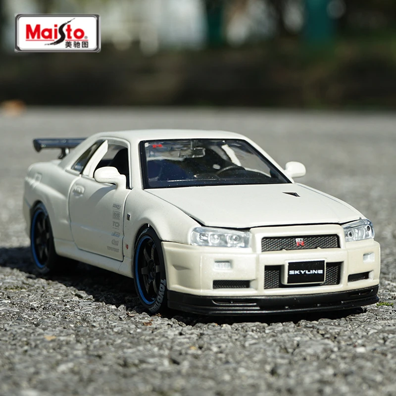 Maisto 1:24 Nissan Skyline GT-R R34 модифицированная версия литая машина из металлического сплава Модель автомобиля детские игрушки коллекционные подарки B238
Maisto 1:24 Nissan Skyline GT-R R34 модифицированная версия литая машина из металлического сплава Модель автомобиля детские игрушки коллекционные подарки B238