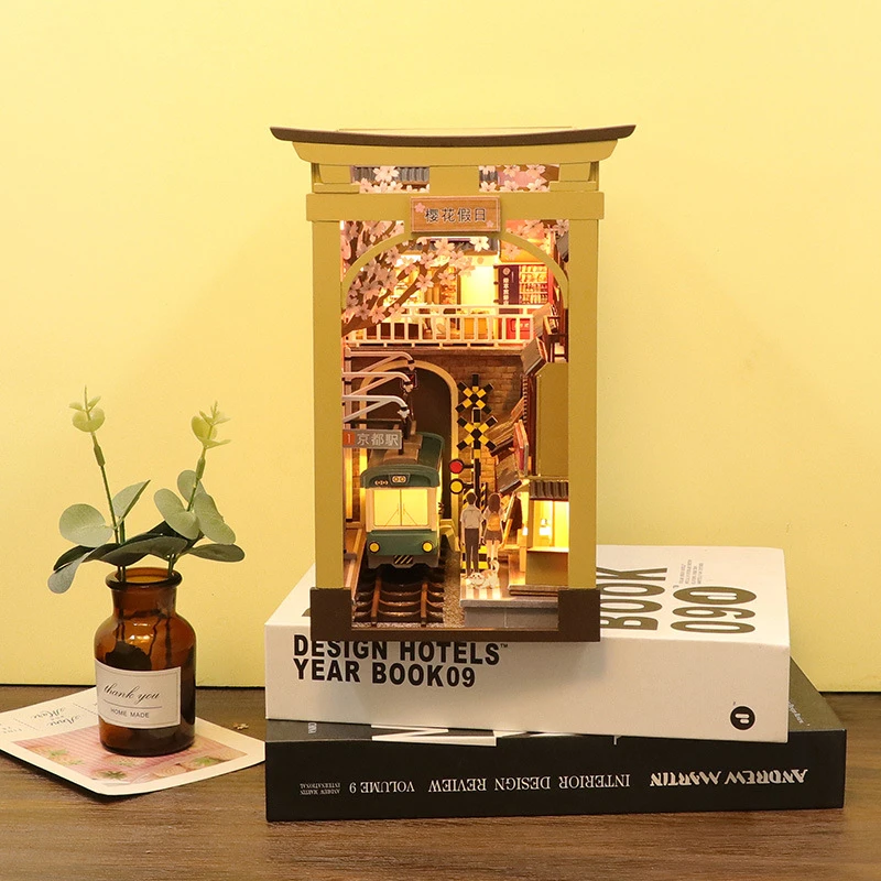 Japanese DIY Wooden Book Nook Shelf Insert Kits Miniature Sakura Train Station Bookend Bookshelf Home Decor Handmade Craft Gifts 
Japanese DIY Wooden Book Nook Shelf Insert Kits Miniature Sakura Train Station Bookend Bookshelf Home Decor Handmade Craft Gifts