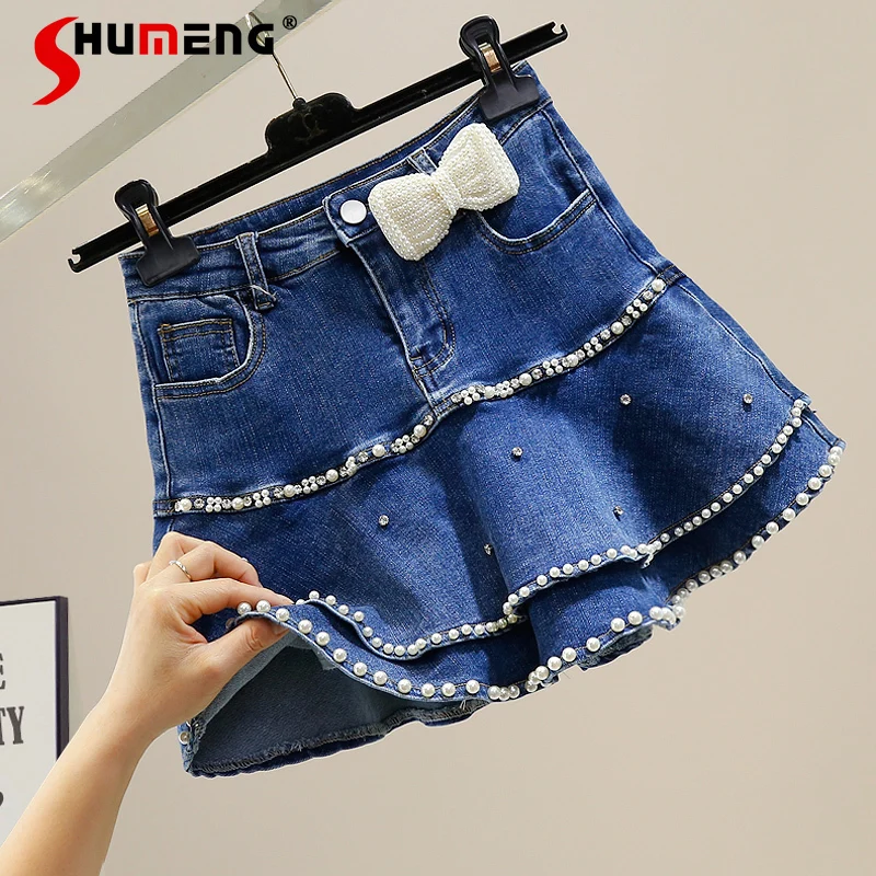 2022 Spring Summer New Female Fashion Sweet Beads Diamond Sweet Bow Skirt Women's Elegant A- Line High Waist Ruffles Denim Skirt
2022 Spring Summer New Female Fashion Sweet Beads Diamond Sweet Bow Skirt Women's Elegant A- Line High Waist Ruffles Denim Skirt