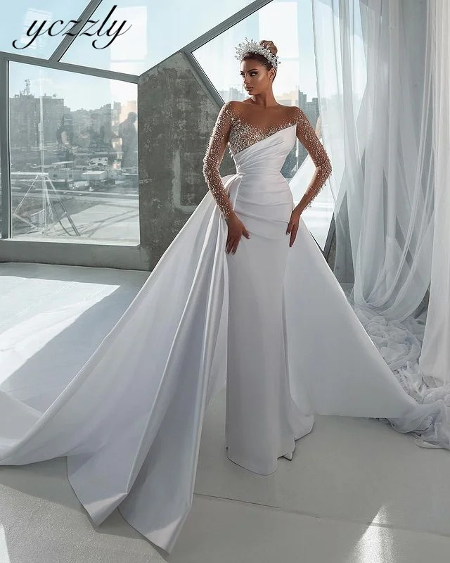 Yczzly Luxury Beading Wedding Dresses Illusion Crystal Long Sleeves Bridal Gown With Detachable Train Satin Arabic Vestido YW43
Yczzly Luxury Beading Wedding Dresses Illusion Crystal Long Sleeves Bridal Gown With Detachable Train Satin Arabic Vestido YW43