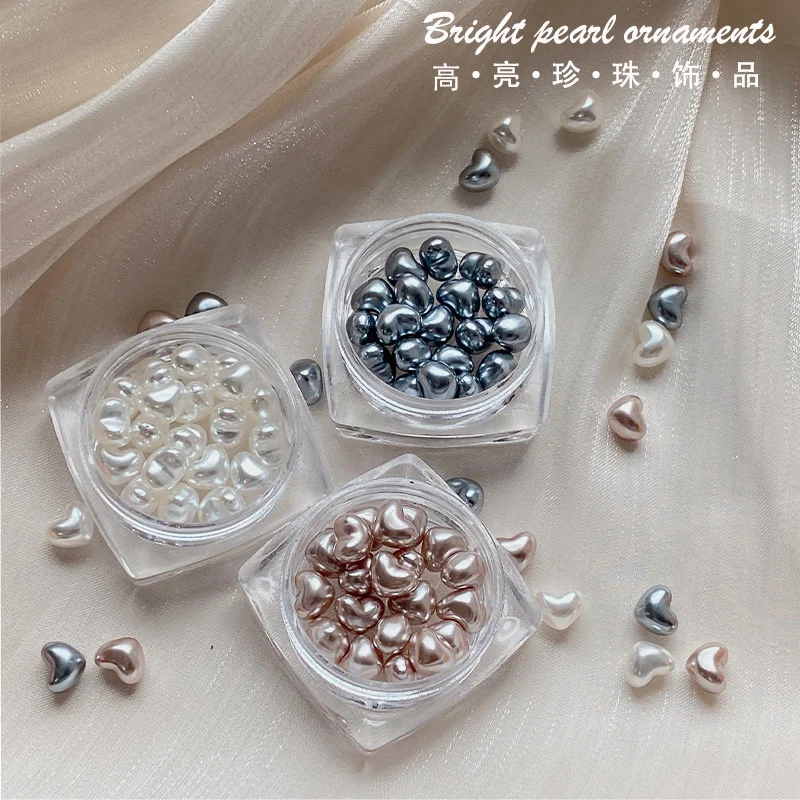 20pcs/Pot New 3D Peach Heart Nail Art Pearl Rhinestone Color 6*5mm Pearl Love Gems Charms For DIY Nail Art Decoration Accessory 
20pcs/Pot New 3D Peach Heart Nail Art Pearl Rhinestone Color 6*5mm Pearl Love Gems Charms For DIY Nail Art Decoration Accessory