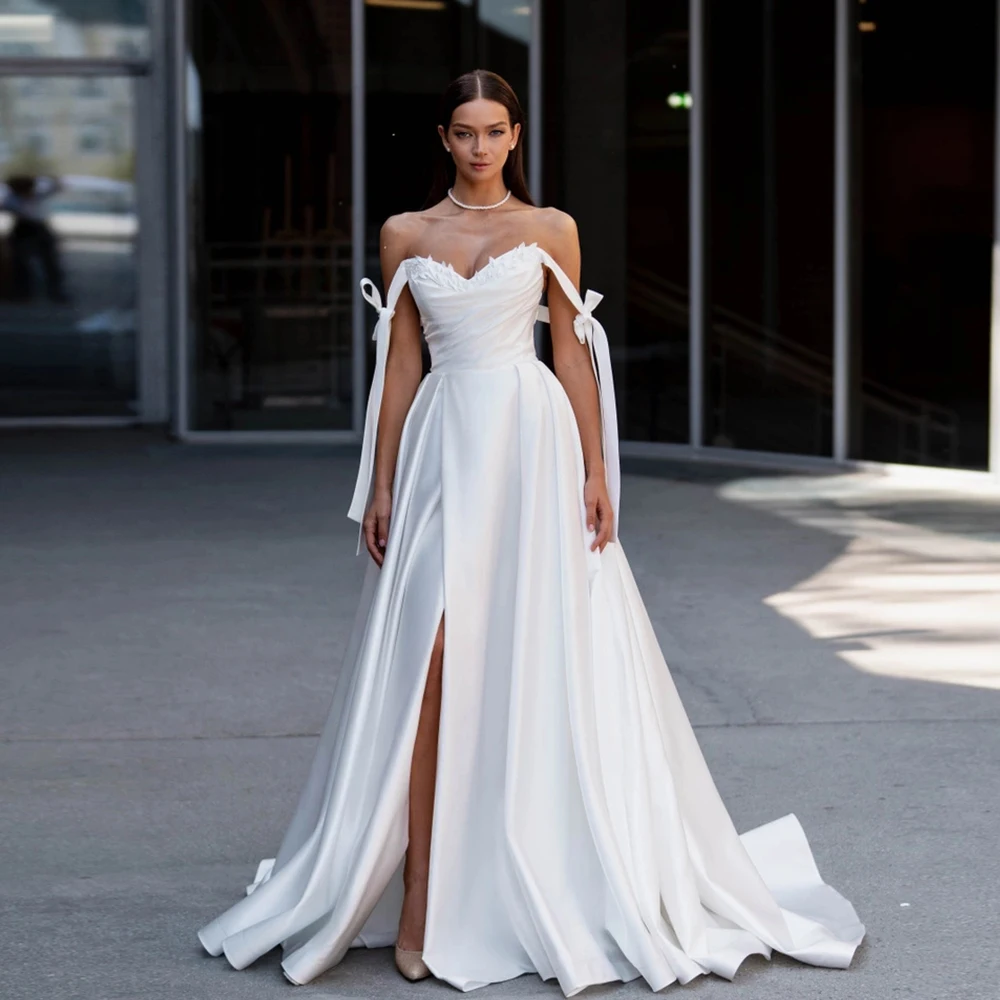 Elegant Wedding Dresses Sweetheart Neck Sleeveless Applique Bow Bridal Gowns A-Line Floor-Length Front Split Robe De Mariee 2023
Elegant Wedding Dresses Sweetheart Neck Sleeveless Applique Bow Bridal Gowns A-Line Floor-Length Front Split Robe De Mariee 2023