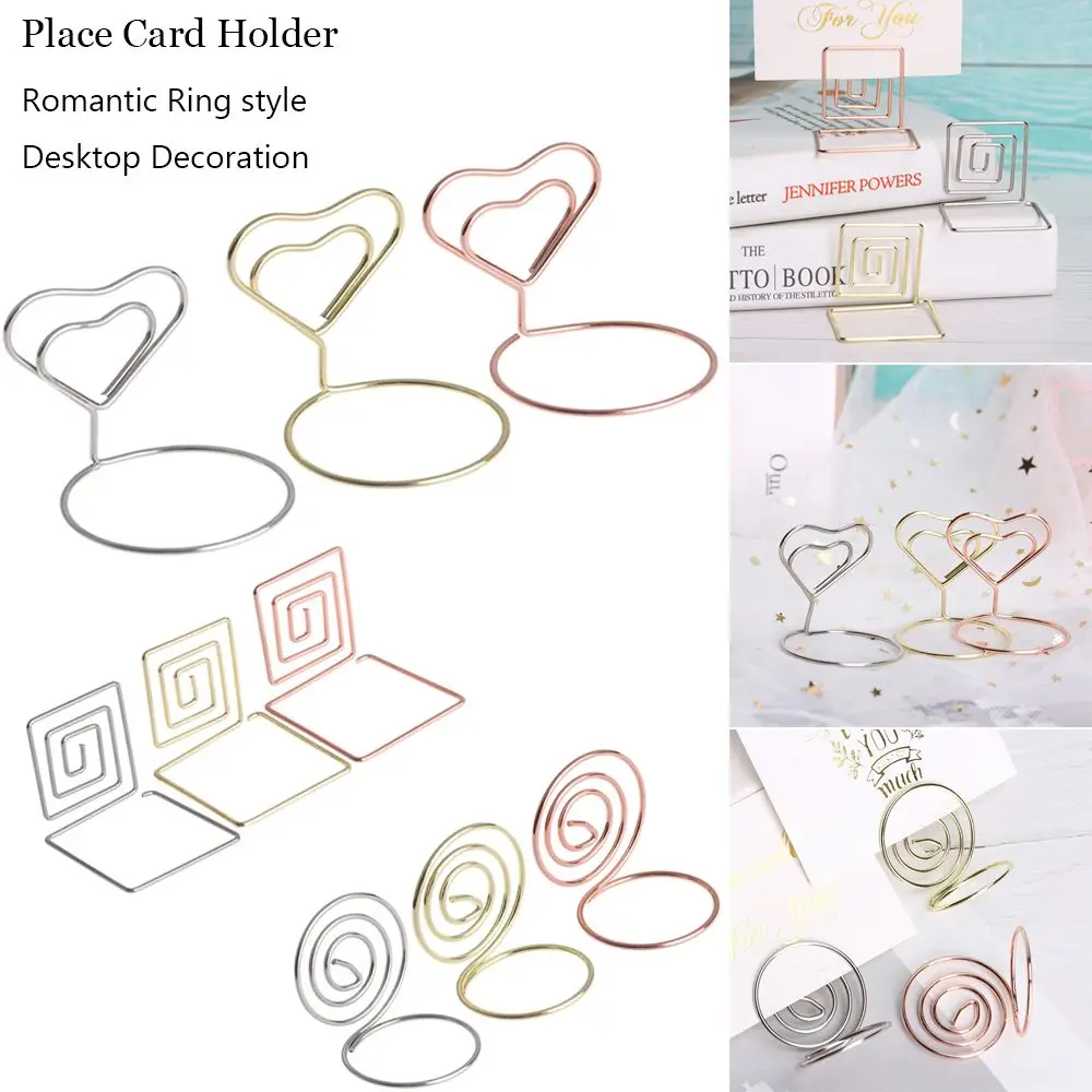 Romantic Wedding Supplies Ring Shape Paper Clamp Heart Shape Photos Clips Place Card Table Numbers Holder Clamps Stand
Romantic Wedding Supplies Ring Shape Paper Clamp Heart Shape Photos Clips Place Card Table Numbers Holder Clamps Stand