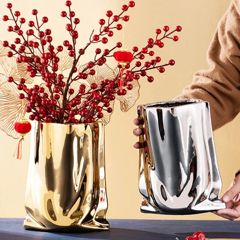 Nordic golden ceramic vase electroplating gold cloth bag ceramic vase living room TV cabinet furniture decoration ornaments vase
Nordic golden ceramic vase electroplating gold cloth bag ceramic vase living room TV cabinet furniture decoration ornaments vase