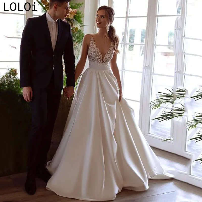 Elegant Satin Lace Top V Neck Spaghetti Strap Backless Wedding Dress 
Elegant Satin Lace Top V Neck Spaghetti Strap Backless Wedding Dress