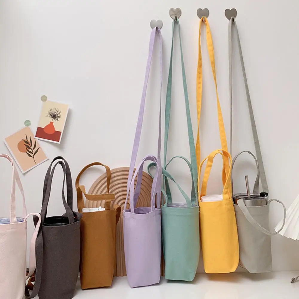 Water Bottle Storage Bag Canvas Portable Organizer Cup Cover With Strap Insulator Sleeve Cup Holder Shoulder Bag Bottle Carrier
Water Bottle Storage Bag Canvas Portable Organizer Cup Cover With Strap Insulator Sleeve Cup Holder Shoulder Bag Bottle Carrier