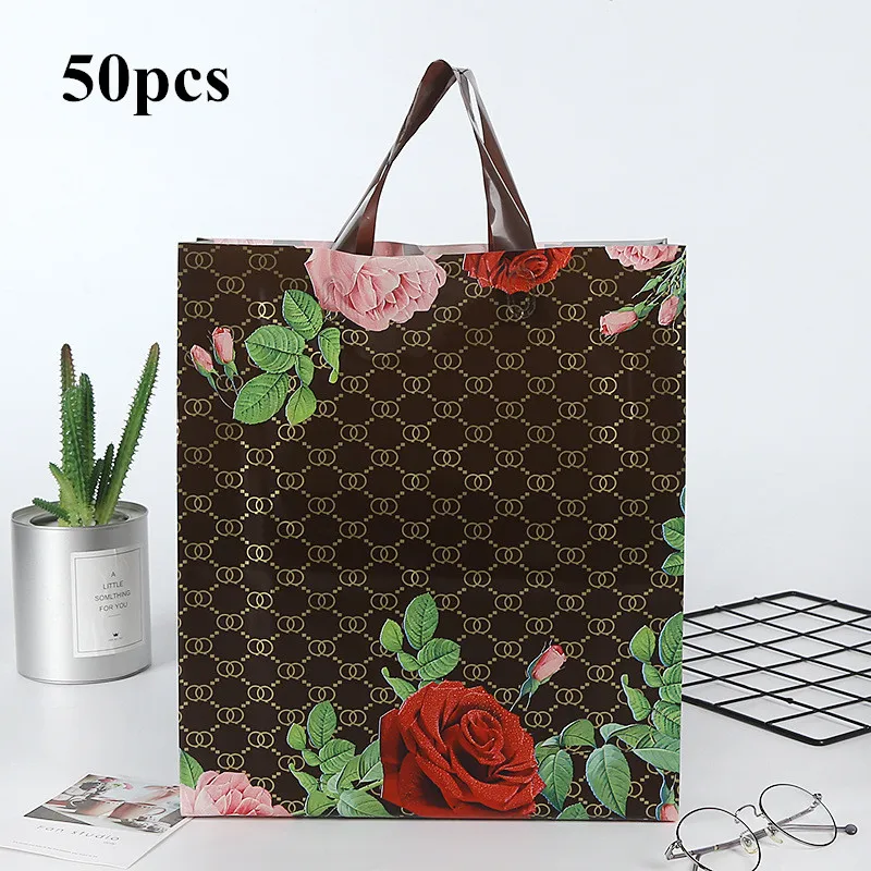 50pcs/bag Rose Pattern Plastic Gift Bags Thick Portable Storage Shopping Bags Clothing Store Bags Wedding Party Supplies
50pcs/bag Rose Pattern Plastic Gift Bags Thick Portable Storage Shopping Bags Clothing Store Bags Wedding Party Supplies