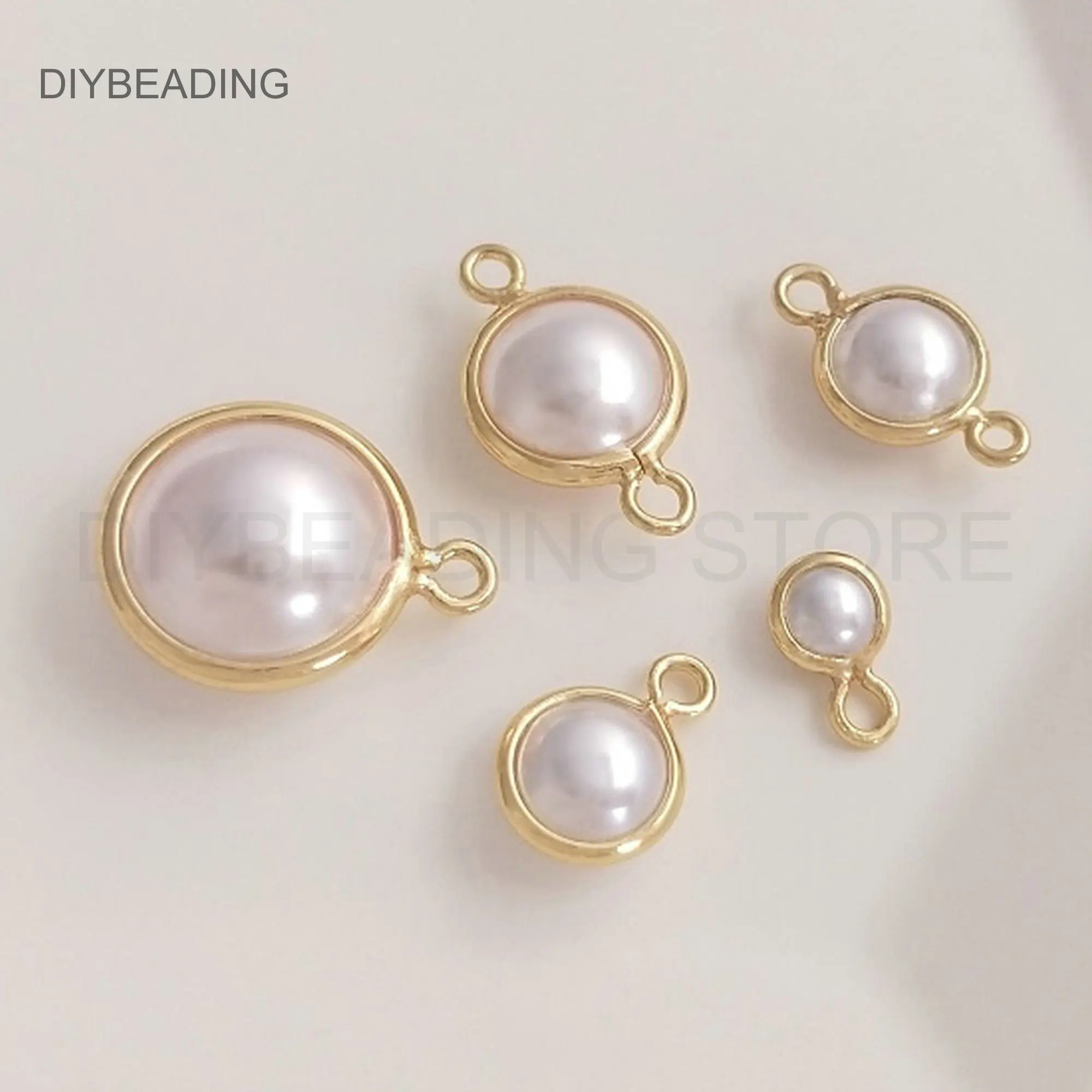Charm Connectors for Jewelry Making 14K Gold Plated White Pearl Shell Round Ball Pendant Lots Wholesale Supply (4/6/8/10mm)
Charm Connectors for Jewelry Making 14K Gold Plated White Pearl Shell Round Ball Pendant Lots Wholesale Supply (4/6/8/10mm)