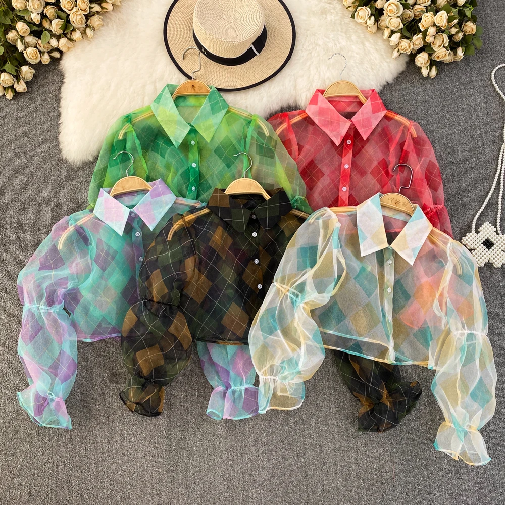 2023 spring and autumn Korean style design perspective single-breasted mesh shirt women's short section
2023 spring and autumn Korean style design perspective single-breasted mesh shirt women's short section