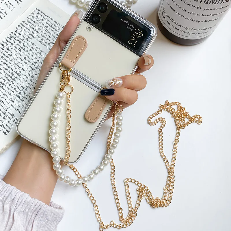 Portable Pearl Bracelet With Crossbody Gold Long Chain Phone Case For Samsung Galaxy Z Flip 4 3 5G Transparent Hard Slim Cover
Portable Pearl Bracelet With Crossbody Gold Long Chain Phone Case For Samsung Galaxy Z Flip 4 3 5G Transparent Hard Slim Cover