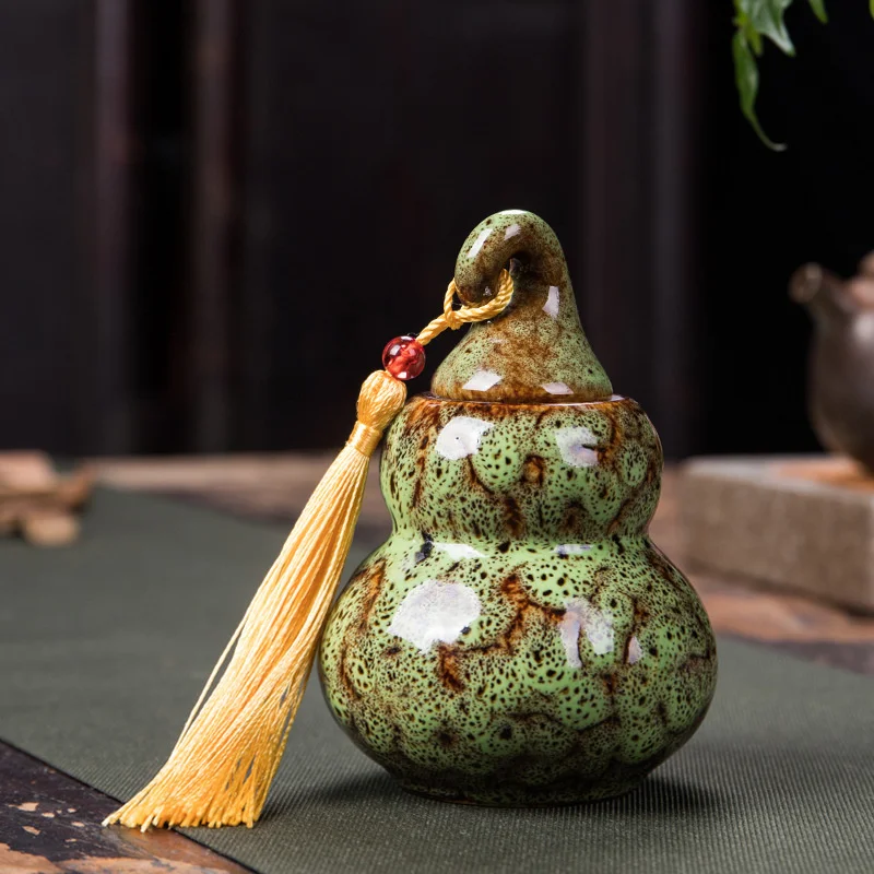 trumpet Chinese mini gourd tea pot ceramic portable kiln glaze change creative sealed medicine pot storage tank empty pot jars
trumpet Chinese mini gourd tea pot ceramic portable kiln glaze change creative sealed medicine pot storage tank empty pot jars