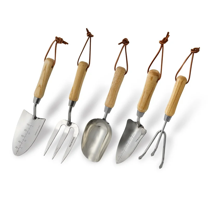Genuine gardening shovel thickened stainless steel thickened flower-raising wooden handle tool household catching sea set
Genuine gardening shovel thickened stainless steel thickened flower-raising wooden handle tool household catching sea set