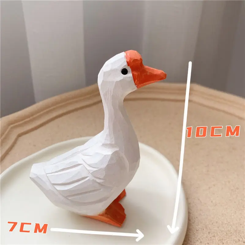 Деревянная статуэтка гуся и пингвина
Деревянная статуэтка гуся и пингвина