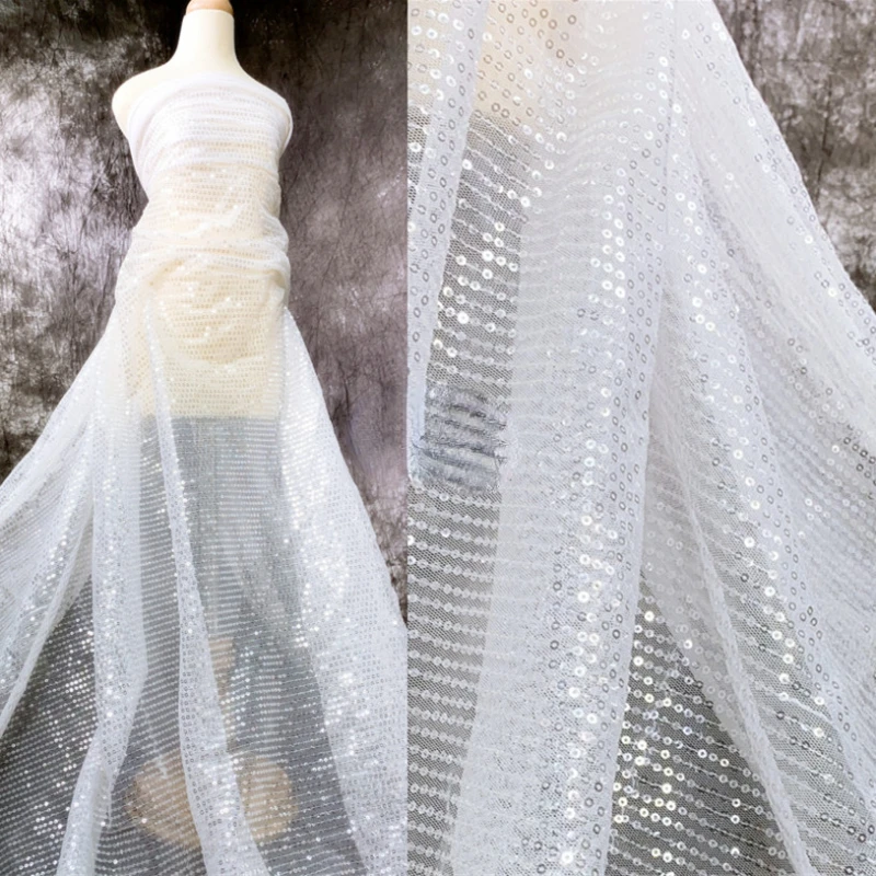 Silver White Sequin Fabric Transparent Dress Clothing Designer Wholesale Cloth for Diy Apparel Sewing Meters Material
Silver White Sequin Fabric Transparent Dress Clothing Designer Wholesale Cloth for Diy Apparel Sewing Meters Material