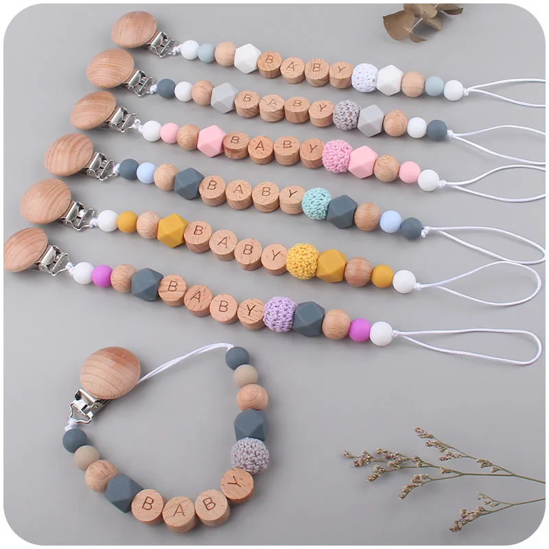 Beech Wood Pacifier Clips Safe Silicone Teething Chain BABY Lettering Kid Teether High Quality Eco-friendly Dummy Clips Kids Toy
Beech Wood Pacifier Clips Safe Silicone Teething Chain BABY Lettering Kid Teether High Quality Eco-friendly Dummy Clips Kids Toy