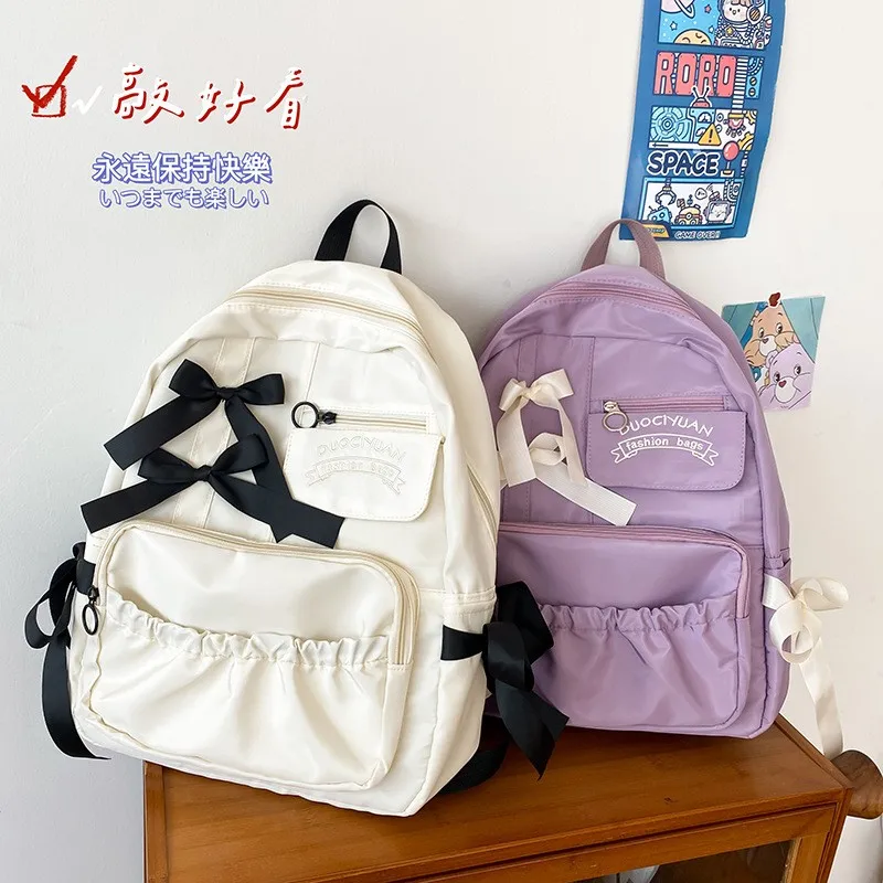 

Women Japanese Sweet Backpack Ladies Cute Hit Color Bow Backpack Large Capacity Travel Mochila College Style Student School Bag