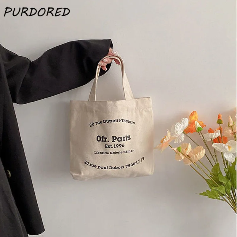 PURDORED 1 Pc Women Letter Mini Handbag Korean Style Canvas Shopping Bag for Boutique Female Letter Print Lunch Bag Tote Pouch
PURDORED 1 Pc Women Letter Mini Handbag Korean Style Canvas Shopping Bag for Boutique Female Letter Print Lunch Bag Tote Pouch