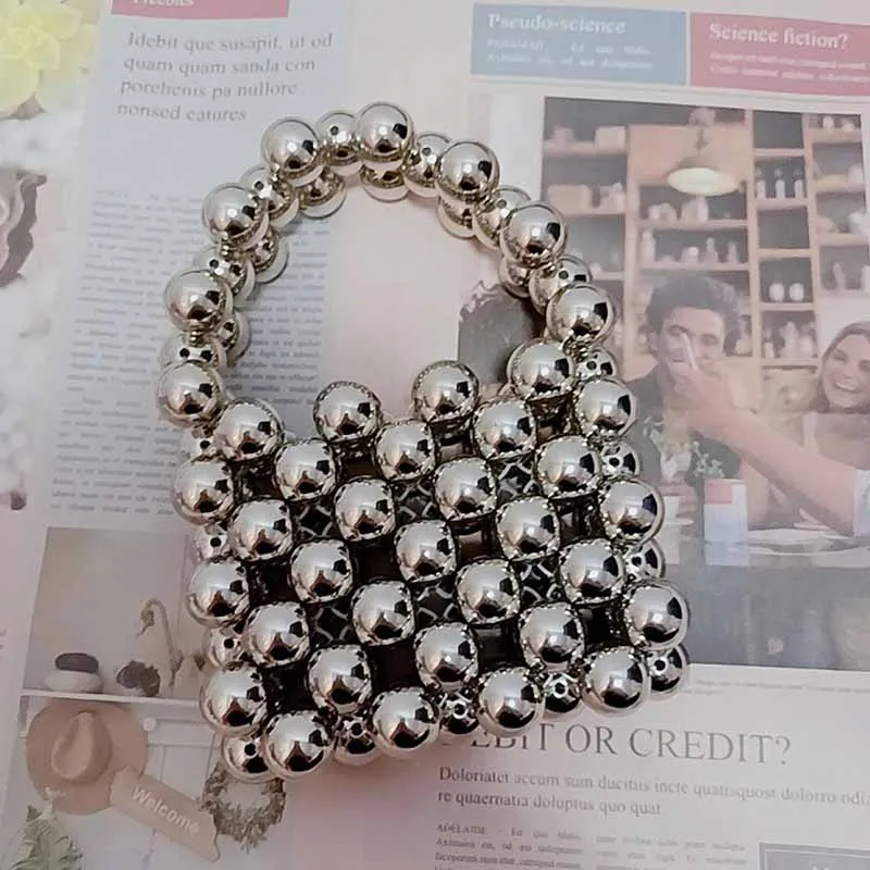 New Fashion Trend Acrylic Hollow Beaded Handbag Metal Silver Beads Pearl Portable Ins Woven Tote Bags for Women 2022 Custom Made
New Fashion Trend Acrylic Hollow Beaded Handbag Metal Silver Beads Pearl Portable Ins Woven Tote Bags for Women 2022 Custom Made